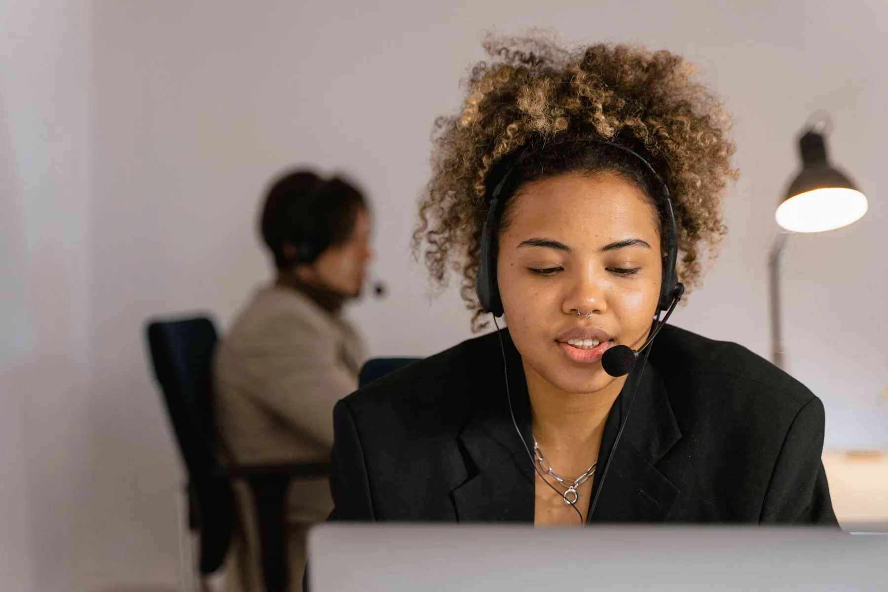 Customer support professional wearing a headset and ready to help